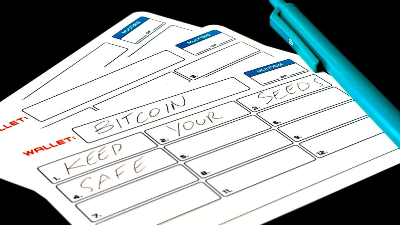 Seed phrase storage stonecard with 'Keep Your Seeds Safe' written on card.