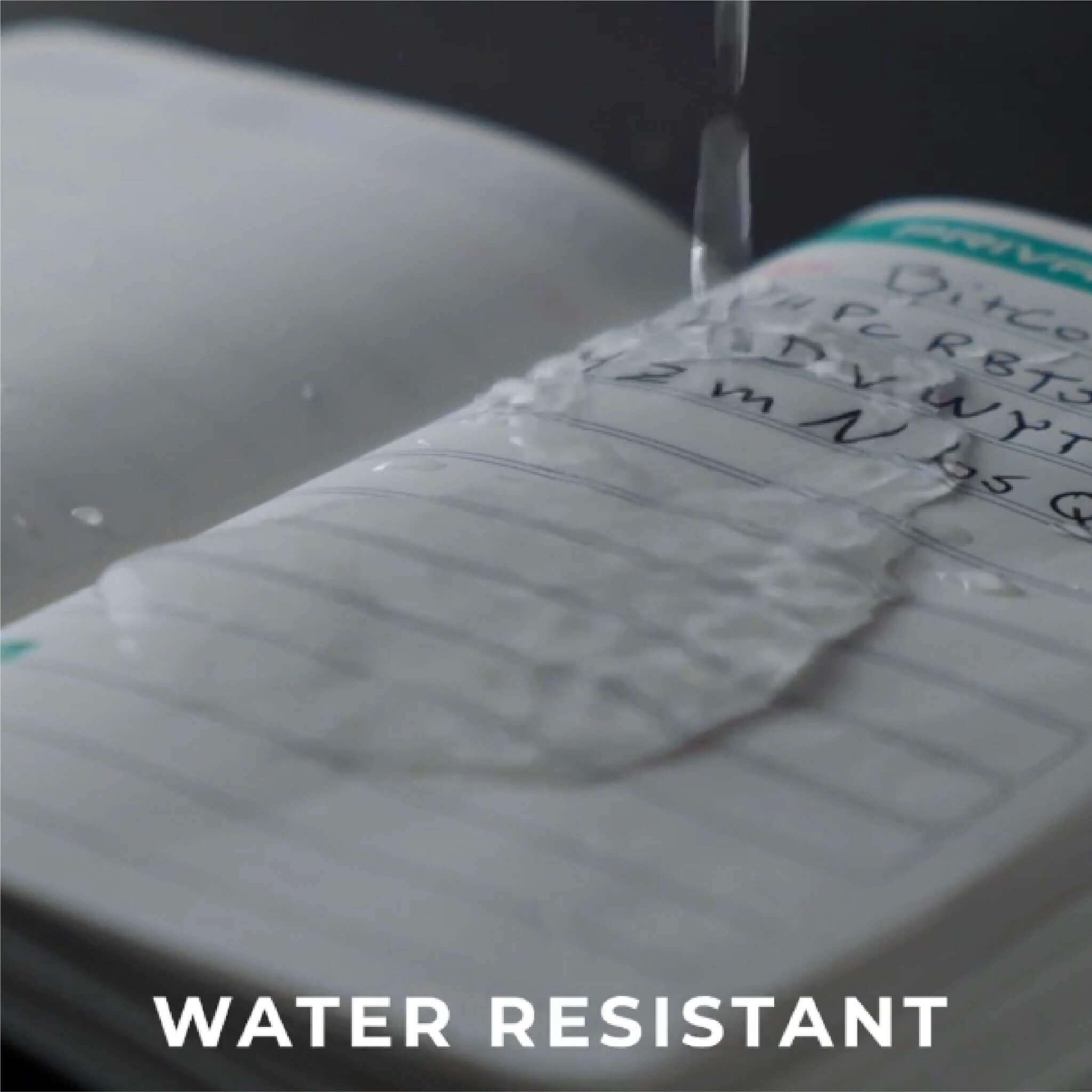 A picture of the Stonebook ™ Notebook having water poured on it, demonstrating it's water resistant pages